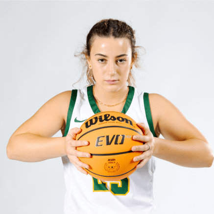 female basketball player holding a basketball