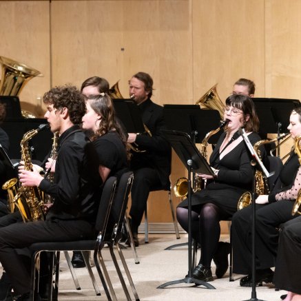a group of musicians playing on a stage