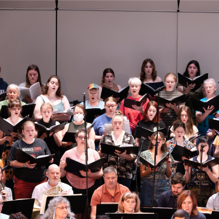 a choir singing on a stage