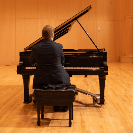 man playing a piano