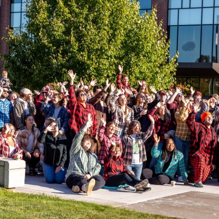 Group of NMU faculty and staff dressed in plaid